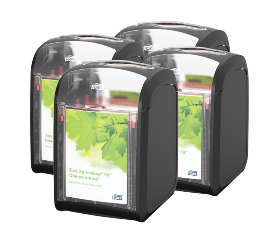 Four black napkin dispensers with transparent fronts displaying green leaf designs, arranged in a group. Tork Xpressnap Fit® Tabletop Napkin Dispenser (5.5 in. x 4.6 in. x 6.8 in., 4/Case)
